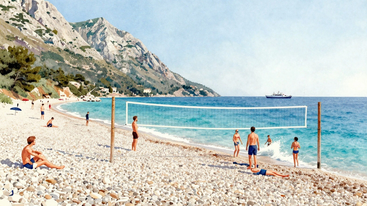 Vibrant pebble beach with people playing volleyball and swimming in clear blue water under a bright sky.